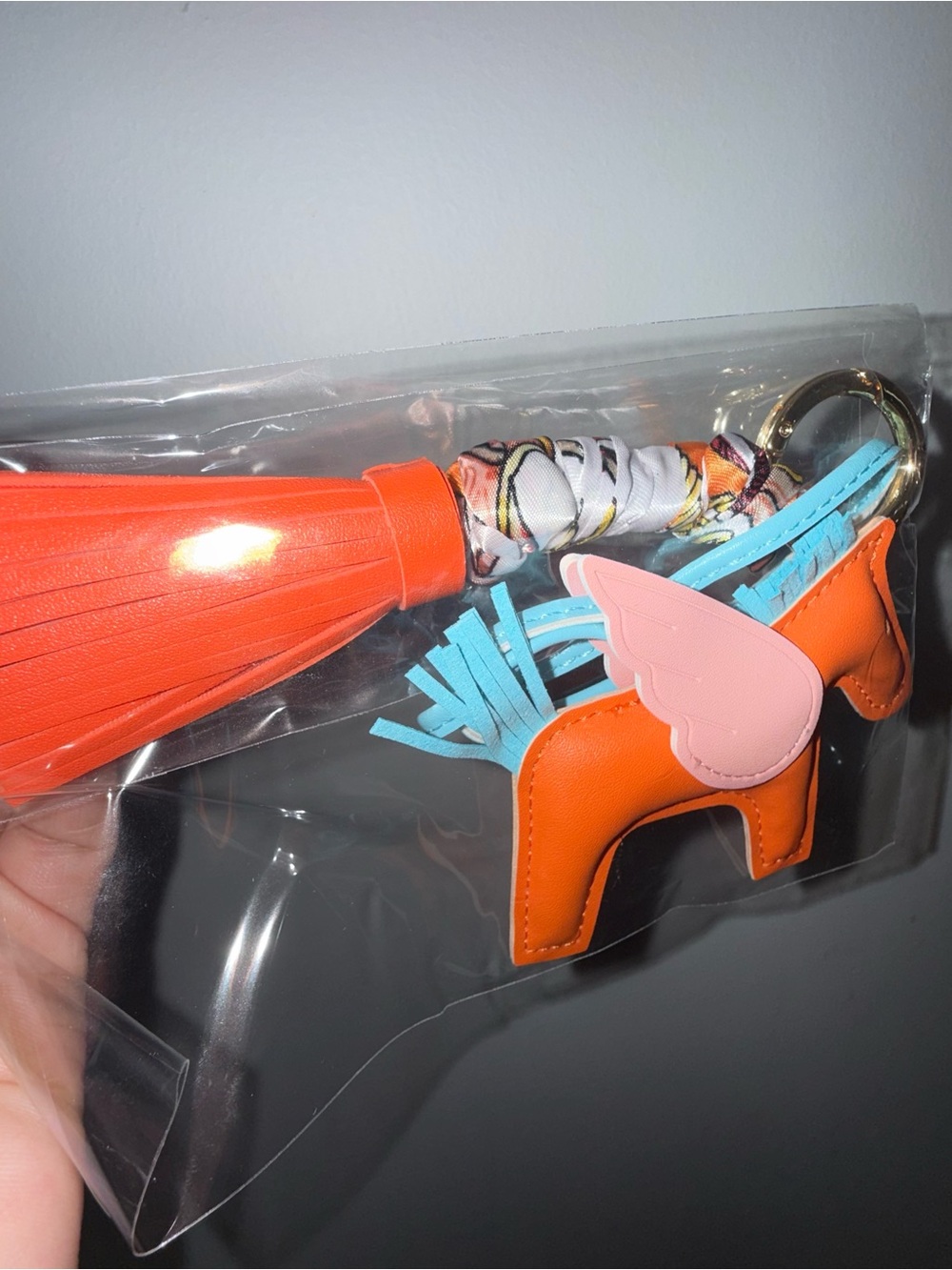 Orange Leather Horse Keychain with Pink Wing & Blue Tassel